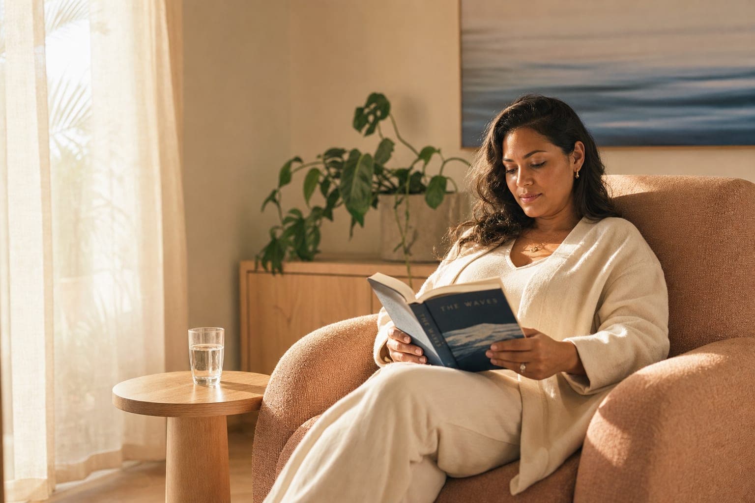 Patient relaxing with a book in the VMRC IV therapy lounge before treatment
